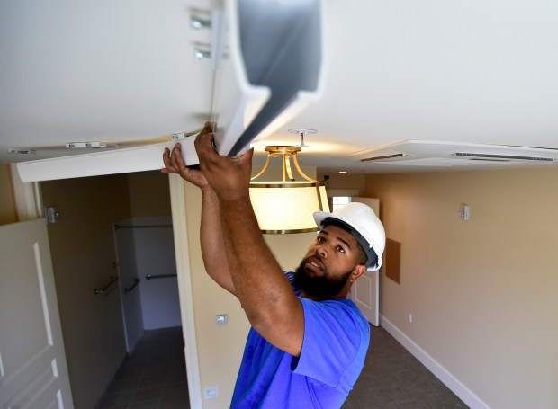 Lifeway Mobility technician performs annual maintenance on ceiling lift track