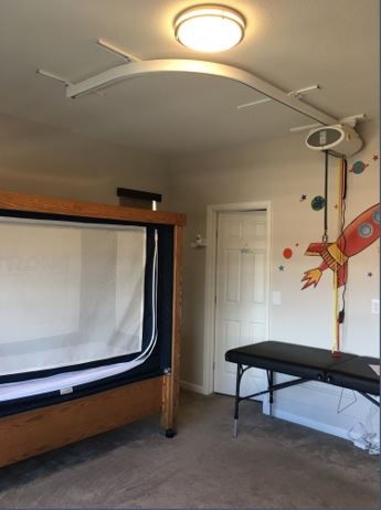 ceiling lift system with curved track for kid with disability