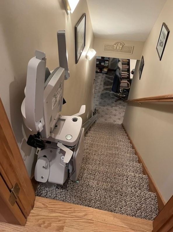 Bruno Elan stairlift with components folded up to maximize space on stairs in Indiana home