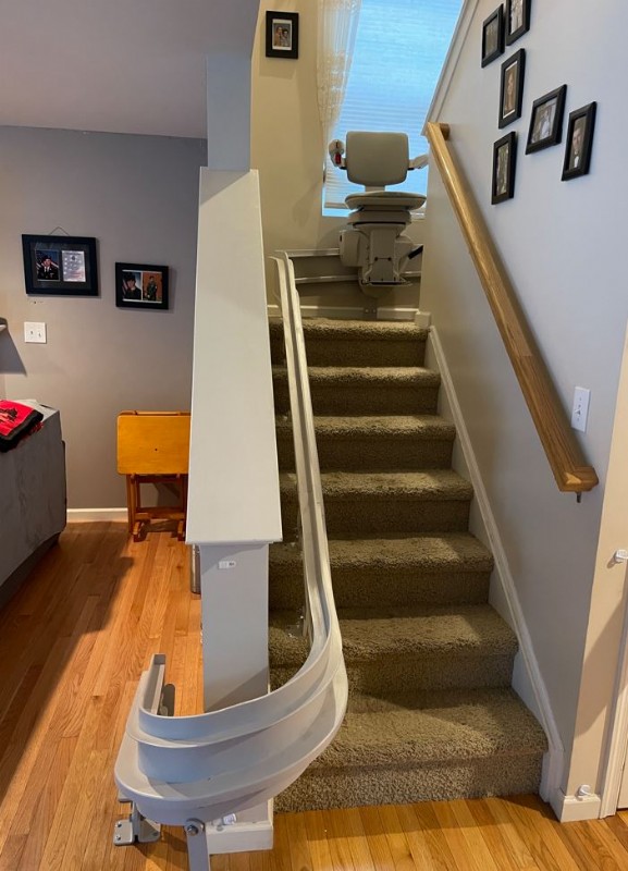 Bruno curved stairlift with chair at middle of staircase bottom view Lifeway Mobility Baltimore