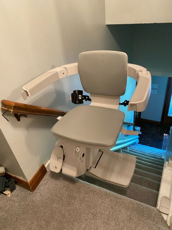 Elan stairlift swiveled away from stairs at top landing in home in Indiana