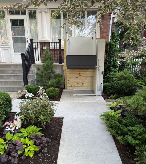 Vertical platform lift installed at front of home in Chicago IL by Lifeway Mobility