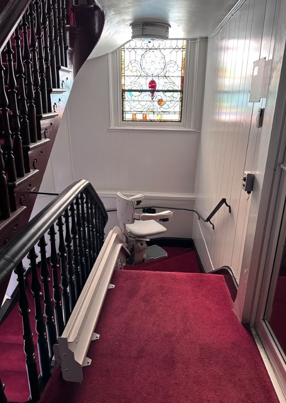 curved stairlift in church with rail overrun at to landing installed by Lifeway Baltimore
