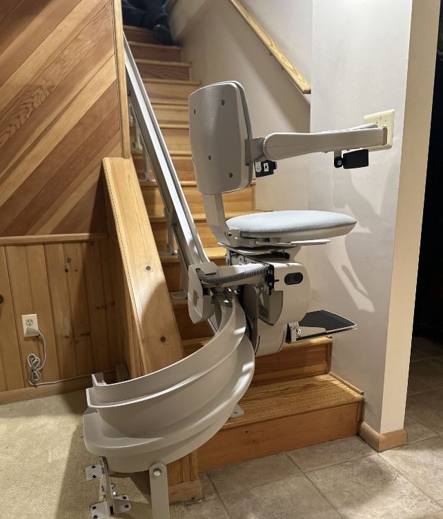curved stairlift installed by Lifeway Mobility on basement stairs with 180 degree park position at bottom