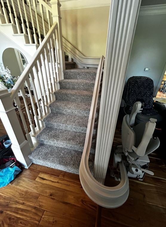 custom curved stairlift with 180 degree rail overrun at bottom landing Indianapolis