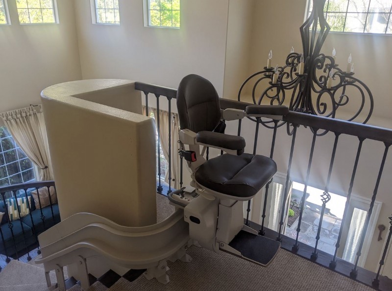 custom curved stairlift with black upholstery installed by Lifeway Mobility in Redwood City California