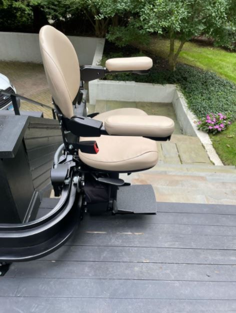 outdoor custom curved stairlift with black painted rail
