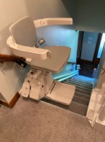 Bruno Elan stairlift at top of staircase in Indinapolis home
