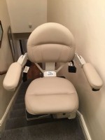 Bruno Elite stairlift with seat swiveled at top landing in Oakland CA