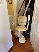 Handicare curved stairlift at bottom landing of stairs in Los Angeles