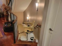 Handicare-curved-stairlift-at-top-landing-of-basement-stairs-in-Philadelphia-home.jpg