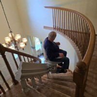 Lifeway-Mobility-customer-rides-new-custom-stairlift-in-home-from-Lifeway-Mobility.JPG