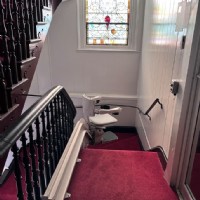 curved stairlift in church with rail overrun at to landing installed by Lifeway Baltimore