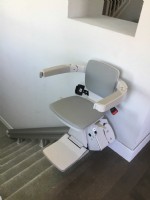 stairlift in San Jose at top landing of staircase
