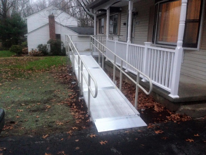 wheelchair ramp leading to front porch of home 