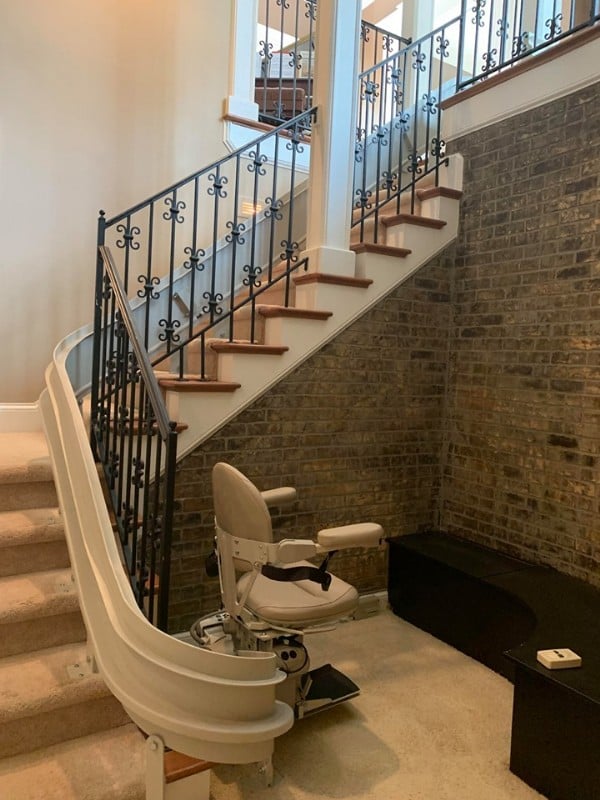 custom-curved-stairlift-at-bottom-landing-in-Indianapolis-home.jpg