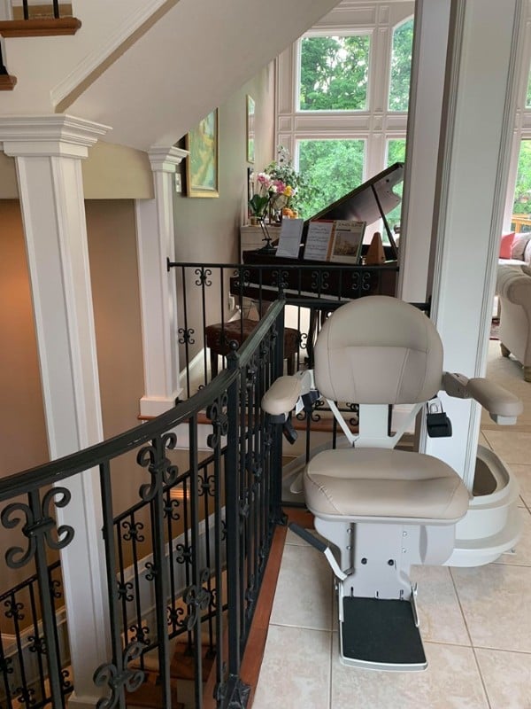 custom curved stairlift with rail overrun at top landing