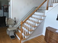 Bruno curved stairlift at bottom landing with components folded up